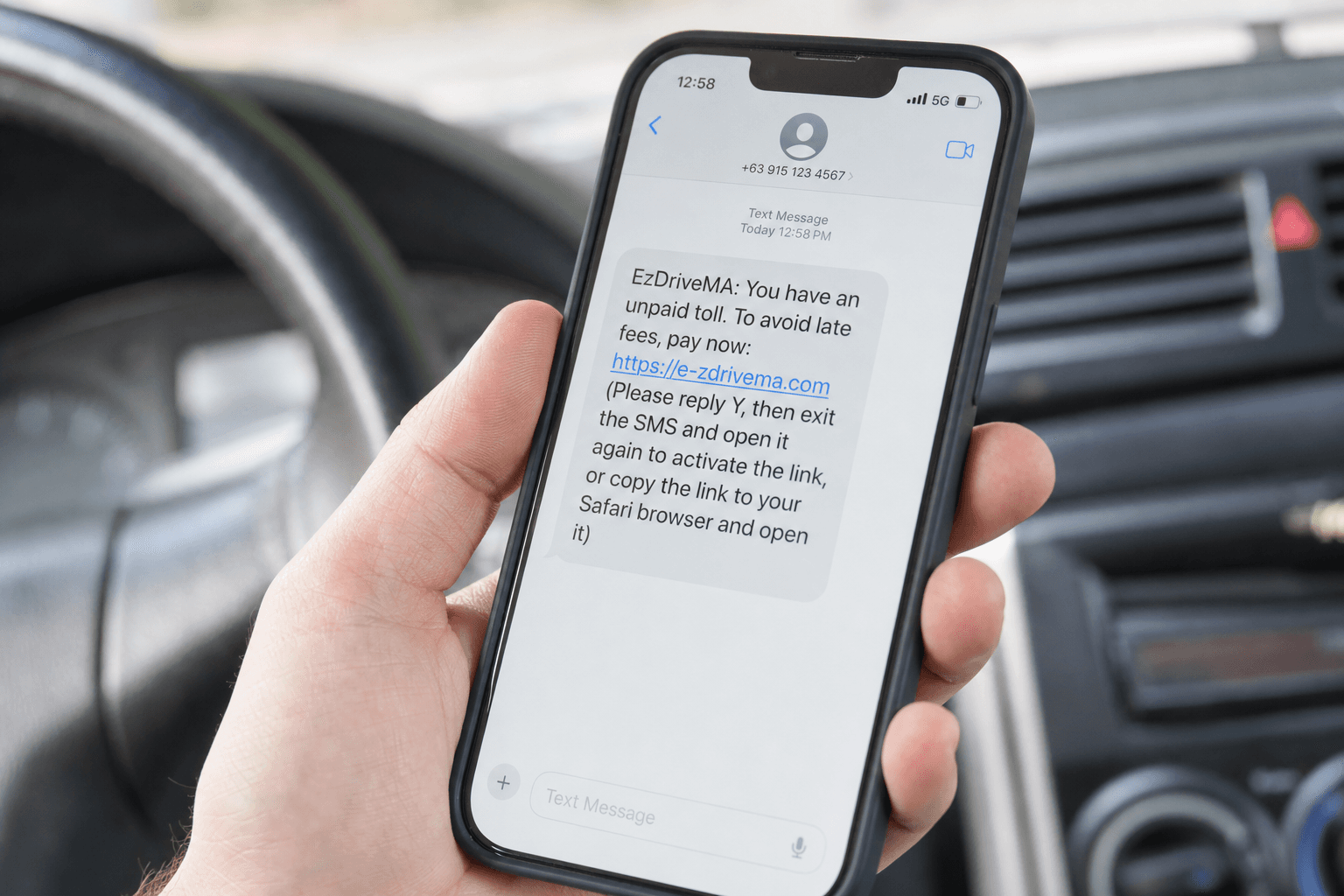 Close-up of a smartphone showing a fake unpaid toll text message demanding immediate payment with a suspicious link